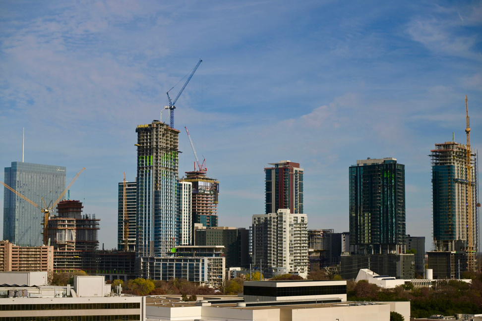 a view of the Austin skyline with construction cranes